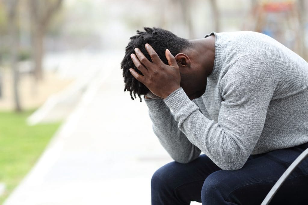 A man feeling overwhelmed after a loved one’s wrongful death.