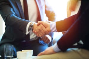 Business people shaking hands, finishing up a meeting