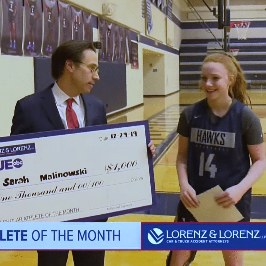 Ted Lorenz giving the Scholar Athlete of the Month award Ted Lorenz giving the Scholar Athlete of the Month award