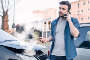 a man calling a car accident lawyer after an accident