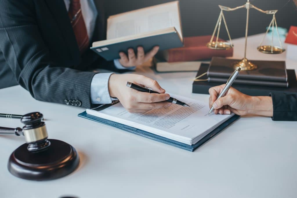 An experienced Austin, Texas auto accident attorney helps a client with their car accident claim.