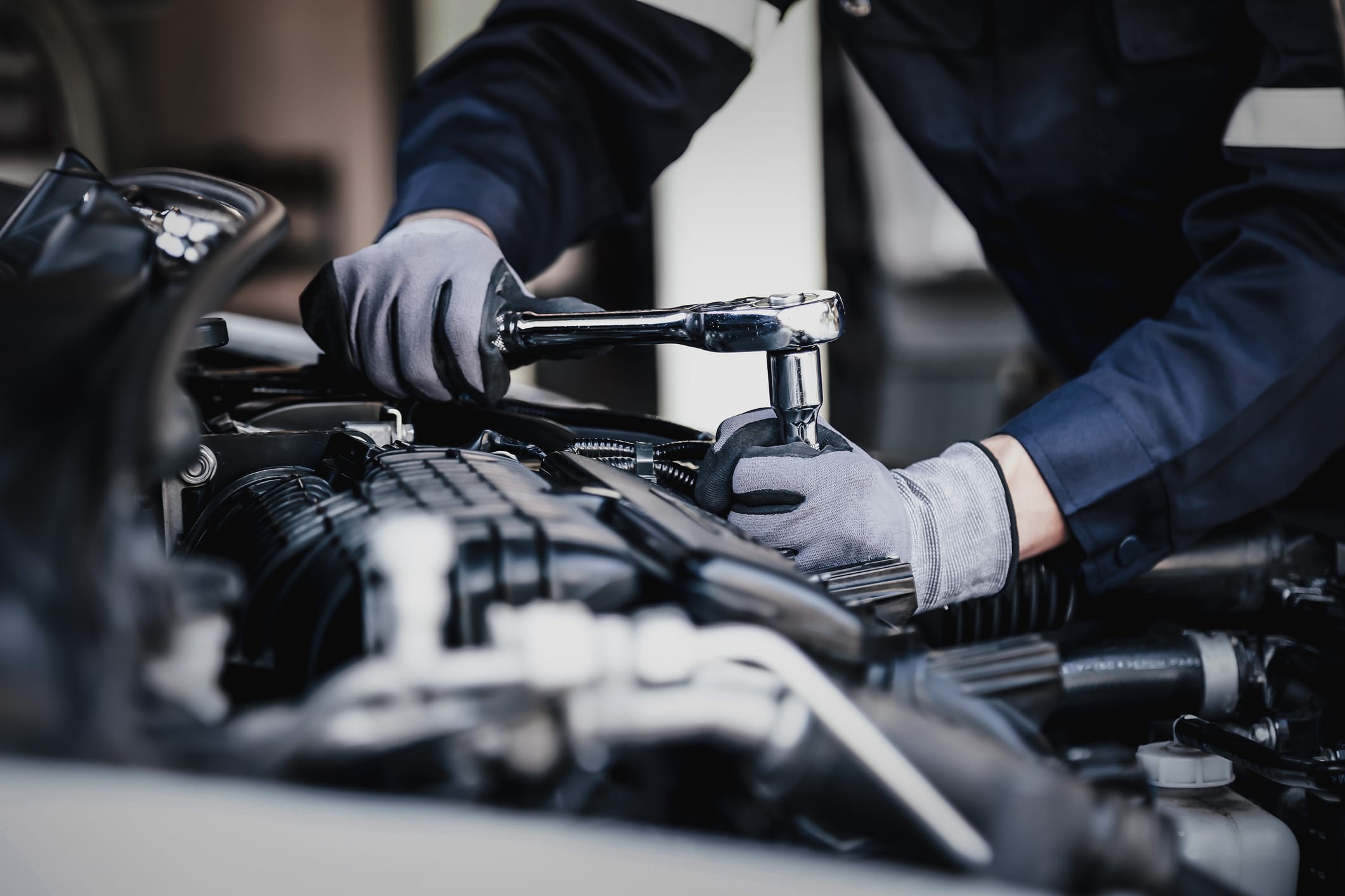 A mechanic works on a vehicle in Texas