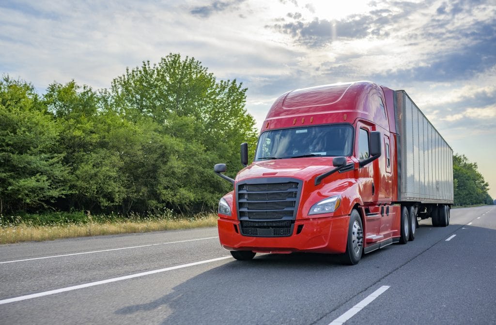 A semi-truck driving on the interstate near Austin