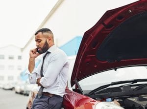 A man calling the police after a car accident. 