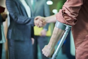 An injured man meeting with his truck accident attorney.