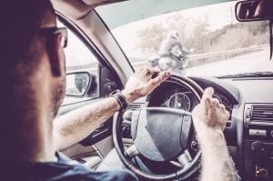 Car driver sees motorcycle emerge from blind spot