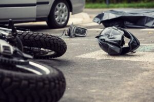 Motorcycle and helmet in the Texas street after dangerous traffic incident.