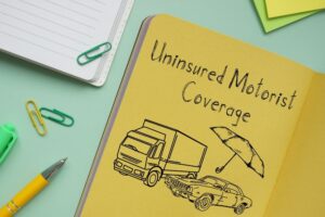 Visual representation of Uninsured Motorist Coverage with text and image of a car.