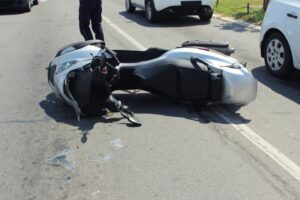 Motorcycle involved in a collision car crash accident.