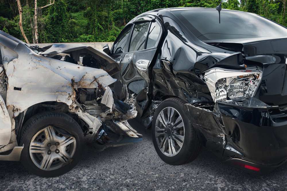 Two vehicles with severe collision damage after a Waco car accident involving comparative fault